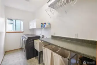 Large laundry room! Newer washer and dryer included.