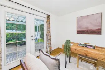 This space is so sweet, and versatile - home office or hobby room - great natural light!