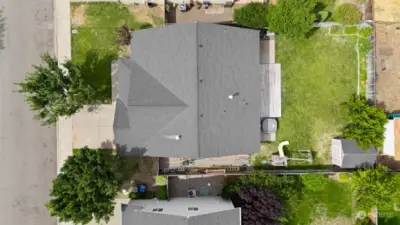 Aerial view of the house and yard space.