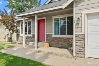 Front entrance with a covered seating area.