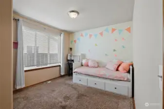 The first bedroom is down the hallway from the front door with a full-size closet.