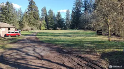 Upper lot with shop and mature fruit trees.