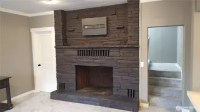Wood-burning fireplace with TV mount above