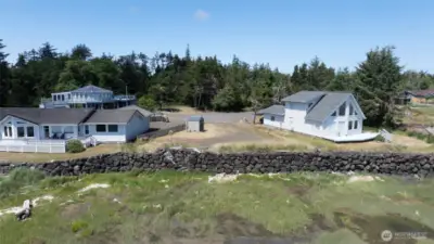 Property is protected by a bulkhead, with a staircase built into the rock wall, leading to the shoreline.