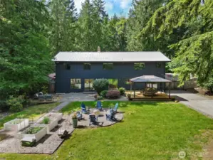 The ultimate flat backyard in Mirrormont - entertainment deck with gazebo, hot tub, fire pit with Adirondack seating, flat grassy area and more!