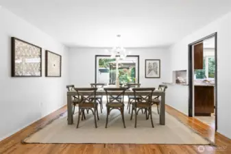 Conveniently located off the kitchen, the formal dining room features sliding doors that open to the backyard—an ideal layout for effortless indoor-outdoor entertaining.