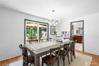 Conveniently located off the kitchen, the formal dining room features sliding doors that open to the backyard—an ideal layout for effortless indoor-outdoor entertaining.