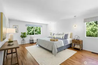 Large ensuite primary with walk-in closet.