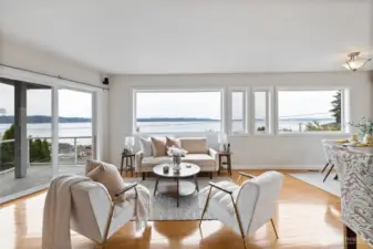 A wall of windows welcomes you into the space and out to the view.