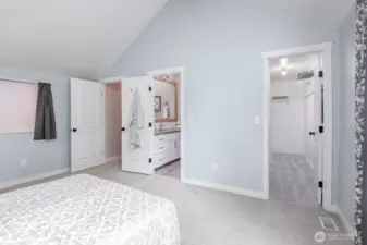 Primary bedroom with view of walk in closet and primary bath