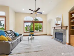 Cozy gas fireplace, tall ceilings, picture windows for plenty of natural light.