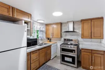 Newer gas double oven/range.  All appliances stay.