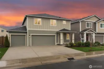3 car garage with electric car outlet & heat pump.
