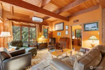 Living room with den in the background