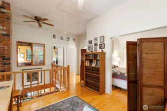 Upstairs loft with primary bedroom to the right