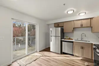 Light Filled with Sliding Glass Door Leading to Balcony!