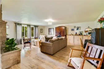 The arched doorways add character to the large living room with fireplace and a stunning picture window.