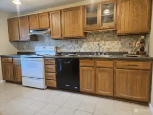 An efficient kitchen with plenty of cabinets for storage