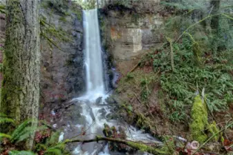 This is Bulson Creek Falls, a very short hike nearest to Lot 3 & 4. Breathtaking view from the bottom of the 64'  falls. See the Swan lower left?    Disclaimer: Renderings, photos, floor plans, prices, and all content, including all verbiage, is not contractual and is subject to change at any time. Call Bruce Lystad for details.