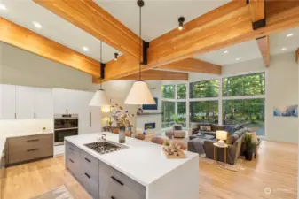 Quartz counter surfaces and backsplash with hidden outlets for a clean, sleek presentation.