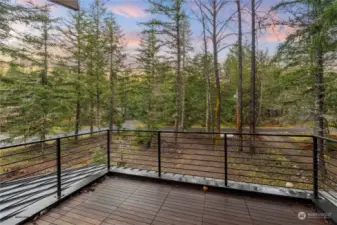 Upper deck off primary suite with fantastic territorial view. IPE decking material and custom metal railing.