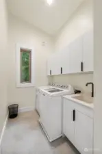 Upper Floor Laundry with linen closet.