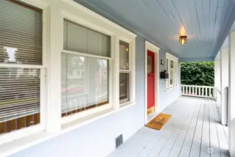 Expansive covered front porch runs the length of the home overlooking the front yard.