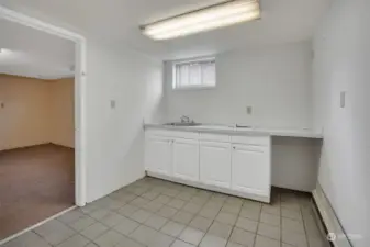 Lower-level basement kitchenette space.