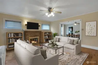 Easy transition from living room to dining room to kitchen. This photo has been virtually staged.