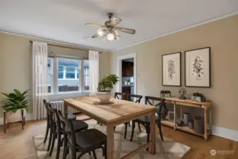 The dining room will hold a large table and chairs for several dinner guests. This photo has been virtually staged.