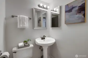 3/4 bathroom with shower tucked away for privacy and convenience.