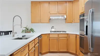 You are going to love this kitchen! It's been totally remodeled, with all new appliances. It's just been outfitted with a double oven, refrigerator, dishwasher, gas stove, and range hood. There is also a new sink and faucet. And to top it all off, the whole kitchen has a large new countertop. Plus, there is a walk-in pantry right by the refrigerator!