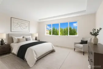 Back inside to the bedrooms.  This big primary bedroom has a coved ceiling and great views out to the east. You will enjoy the wonderful early morning sunshine coming in your window.