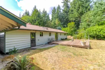 Back of the home with deck.