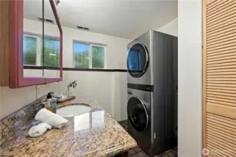 Laundry room with storage.