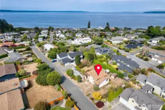 Level 10,890 SF property with Sound and Mountain views.