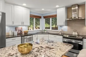 Updated kitchen with granite counters and stainless steel appliances.
