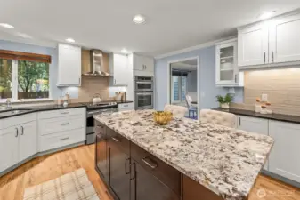 Additional cabinets (not shown in photo) flow along the right wall for pantry space.