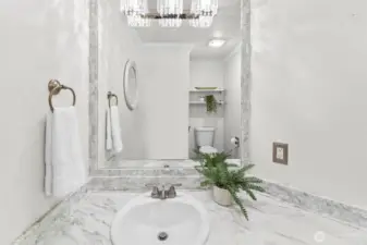Powder bathroom on the main floor with graceful lighting details.