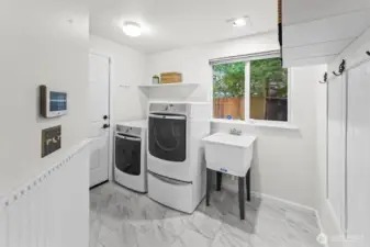 Laundry room with door leading out to the garage.