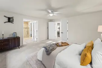 Primary suite with ensuite bath and walk-in closet.