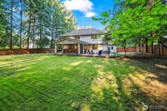 Fully fenced backyard offers space to play and relax.