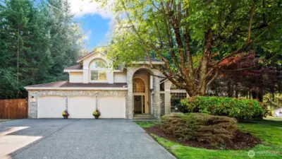Expansive 3-car garage for storage or hobbies.