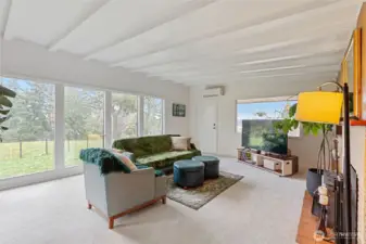 Floor to ceiling picture windows that bring in tons of natural light and exterior views. New carpets too!