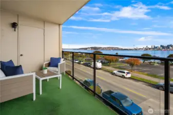 The covered deck and glass railing invite you out during any kind of weather. A Convenient storage closet is one of 3 exterior closets, giving this condo an abundance of storage.