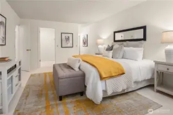 The primary bedroom features an expansive walk-in closet and en-suite bath with double sinks.