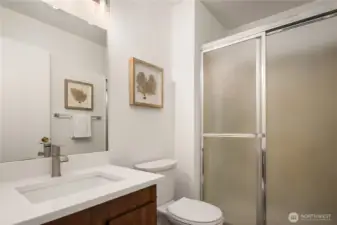 The primary en suite features a walk-in shower, vanity and new paint, counters and fixtures.