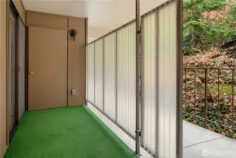 The front entry has another storage closet and more storage options behind the partition.