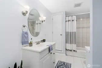 Full bathroom with laundry downstairs and 2nd water heater