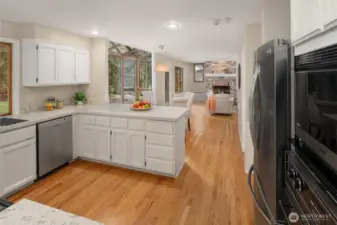 Your kitchen boast new Quartz counters, stainless appliances, tons of storage, seating, and a tranquil forested outlook.